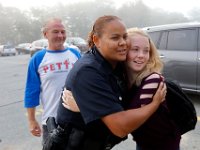 New Bedford police officer, Leanne Fisher, welcomes Skyla Lynk-Romano, 15, back to school for the first time since her accident.  Skyla Lynk-Romano who suffered a traumatic brain injury when she was struck by a car on January 5th attends her first day of school at the Greater New Bedford Regional Vocational Technical High School after a long rehabilitation process at the Pappas Rehabilitation Hospital for Children in Canton, MA. On January 5, 2017, Skyla, a freshman at Greater New Bedford Regional Vocational-Technical High School, was crossing Dartmouth Street to meet her father after leaving the Dancer’s Edge studio when she was hit by a car and critically injured. The driver, Jessica Skaggs, 34, fled the scene before turning herself in. Skaggs has been sentenced to six months at the House of Corrections, but the sentense was suspended for two years. PHOTO PETER PEREIRA